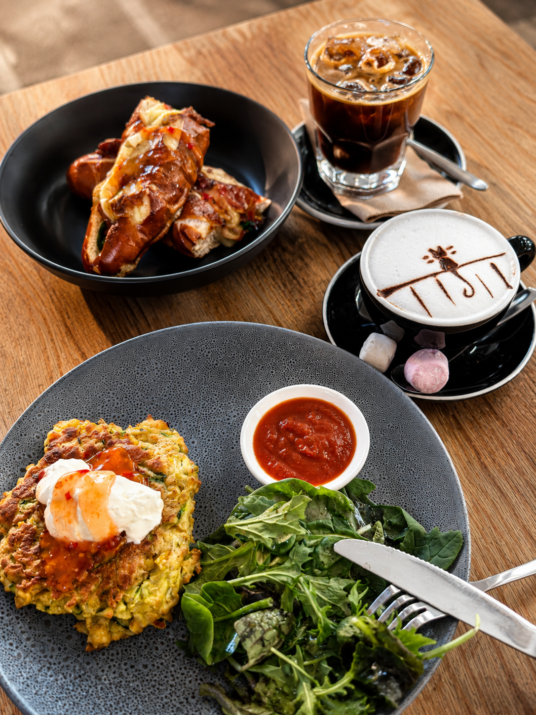 Iced coffee, cafe dishes and a latte at Mitchelli's Cafe Rinato
