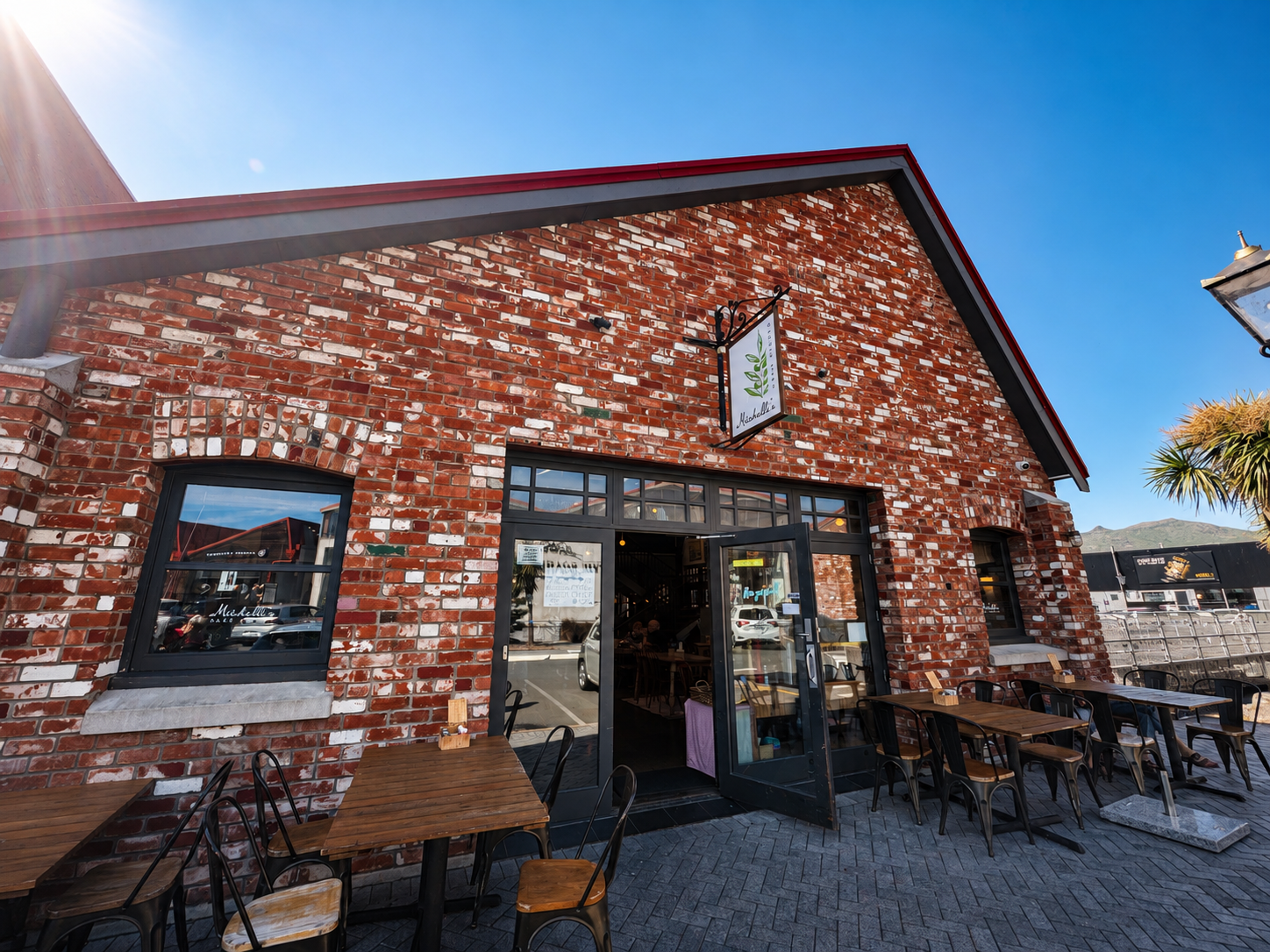 The brick exterior and outdoor tables at Mitchelli's Cafe Rinato